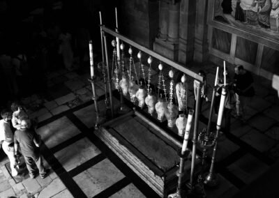 A view of a group of tourists looking at the Stone of Anointing in the Church of the Holy Sepulchre.